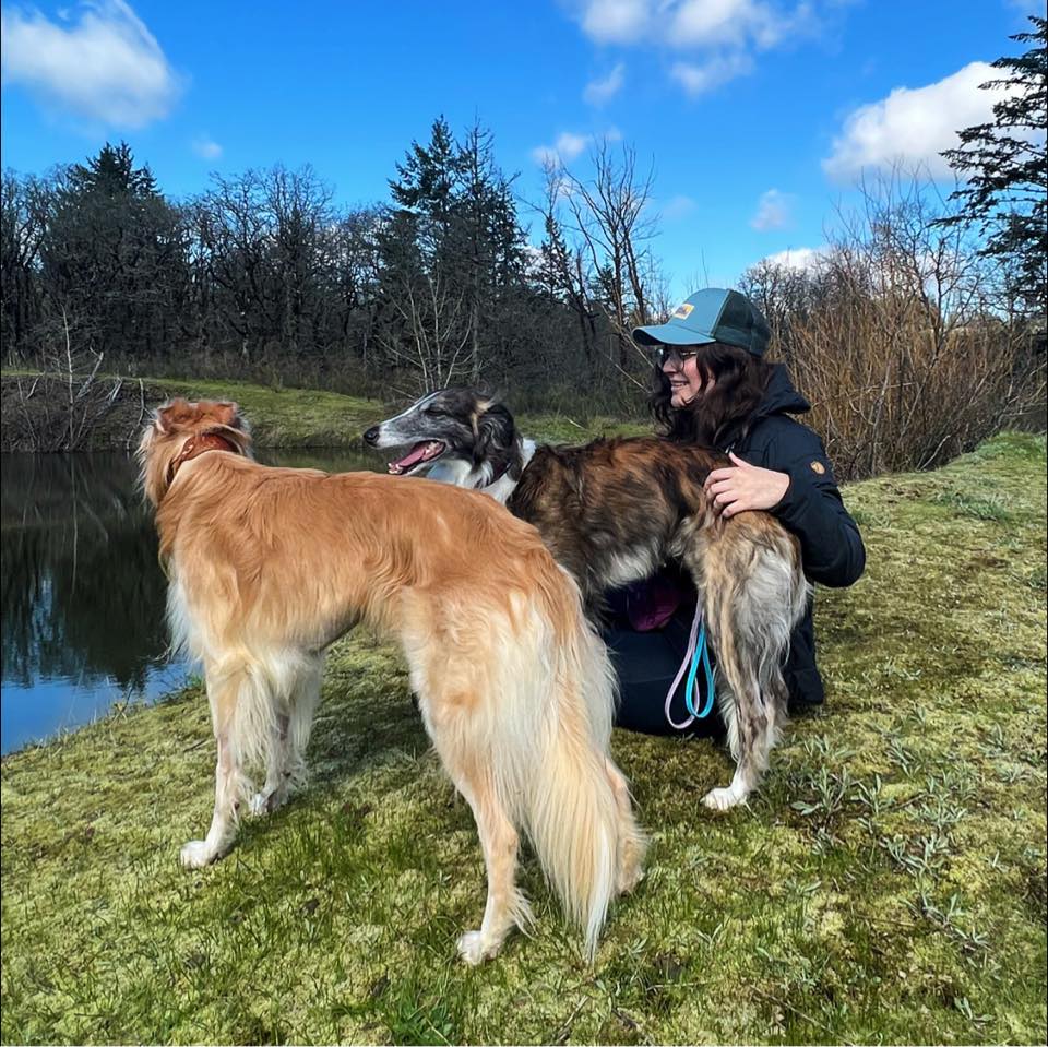 A photo of Aitana and her two dogs.